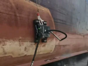 JT-1-H underwater hull cleaning robot removing marine biofouling from ship hull with magnetic wheel adhesion at 50m depth — zero dry-docking required