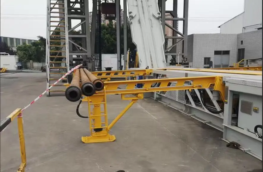 Jingtao electric power catwalk with three drill pipe joints at production facility, Dongying