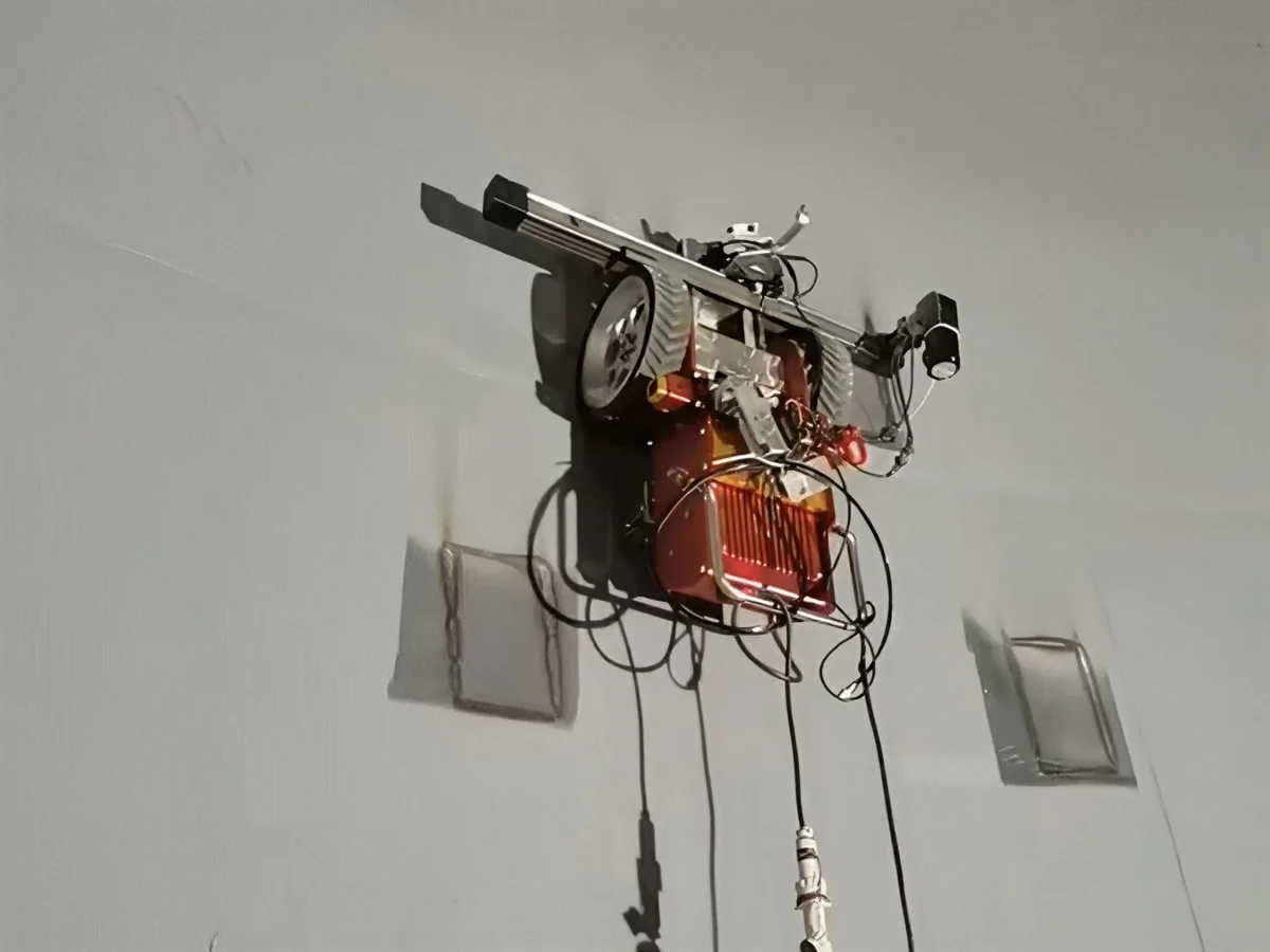 JT-1 wall-climbing robot magnetically attached to a steel tank wall during inspection